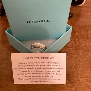 Tiffany & Co. sterling silver Ring with original pouch and box.